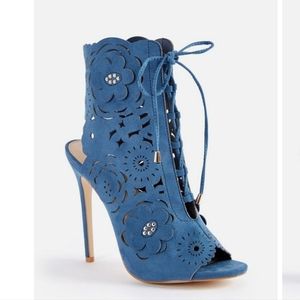 Heeled lace up bootie with open toe and eyelet cut out details